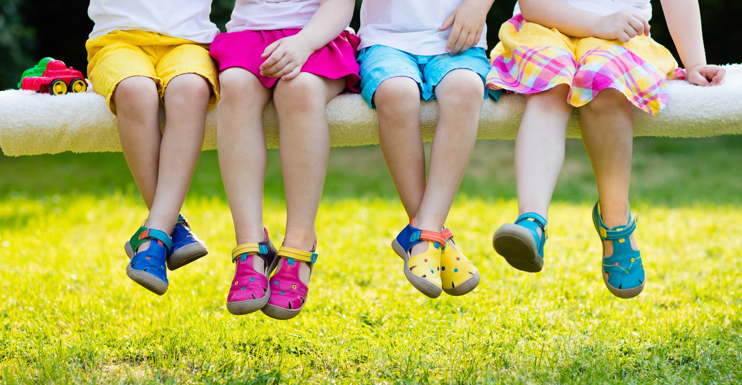 Kids with colorful shoes. Children footwear